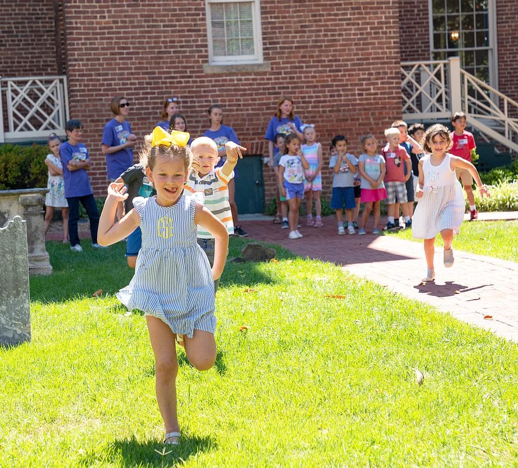 Girl running at Vacation Bible School
